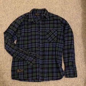 Vermont flannel co, left elbow has been patched (see photo)